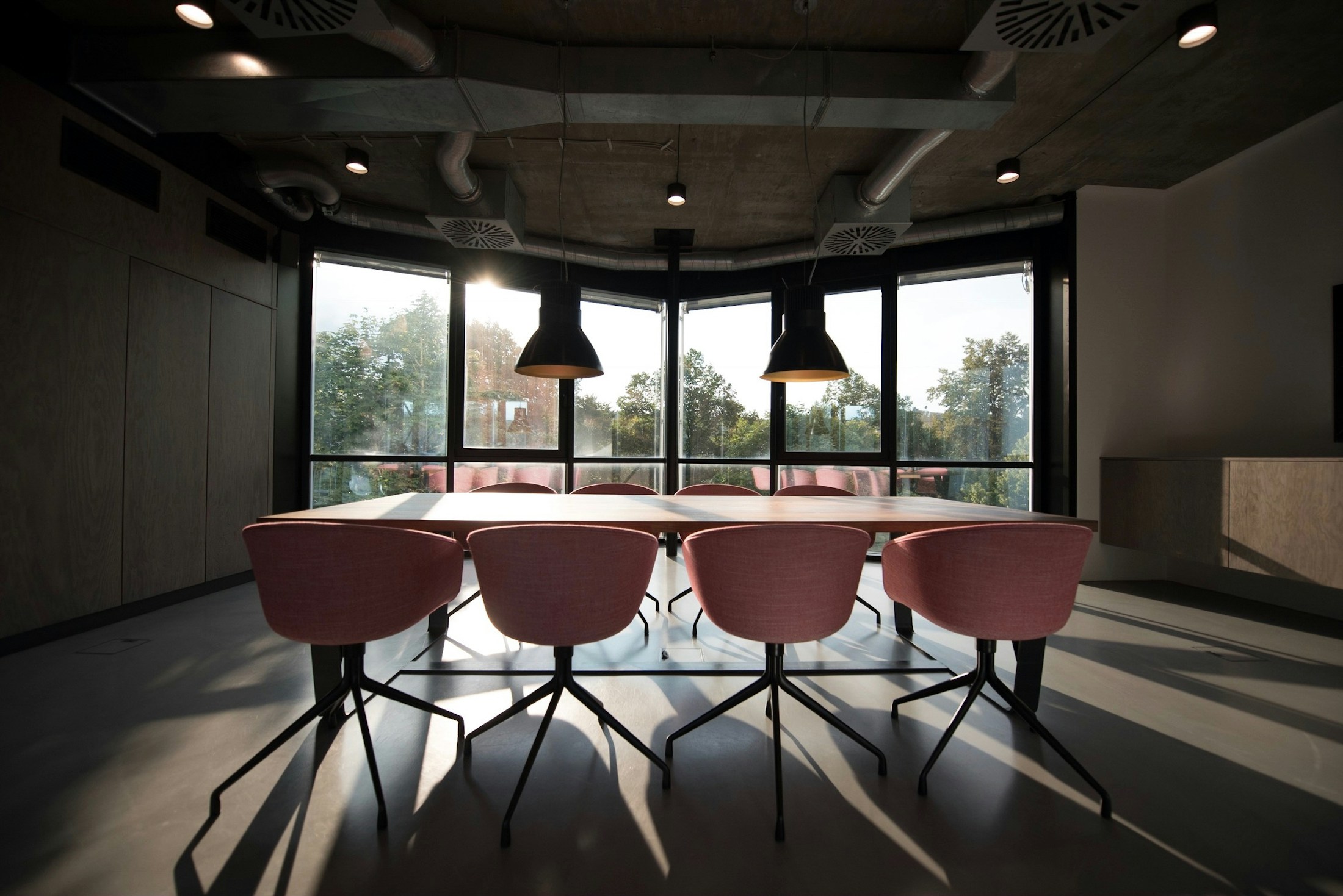 A thoughtfully designed meeting room with a large shared table