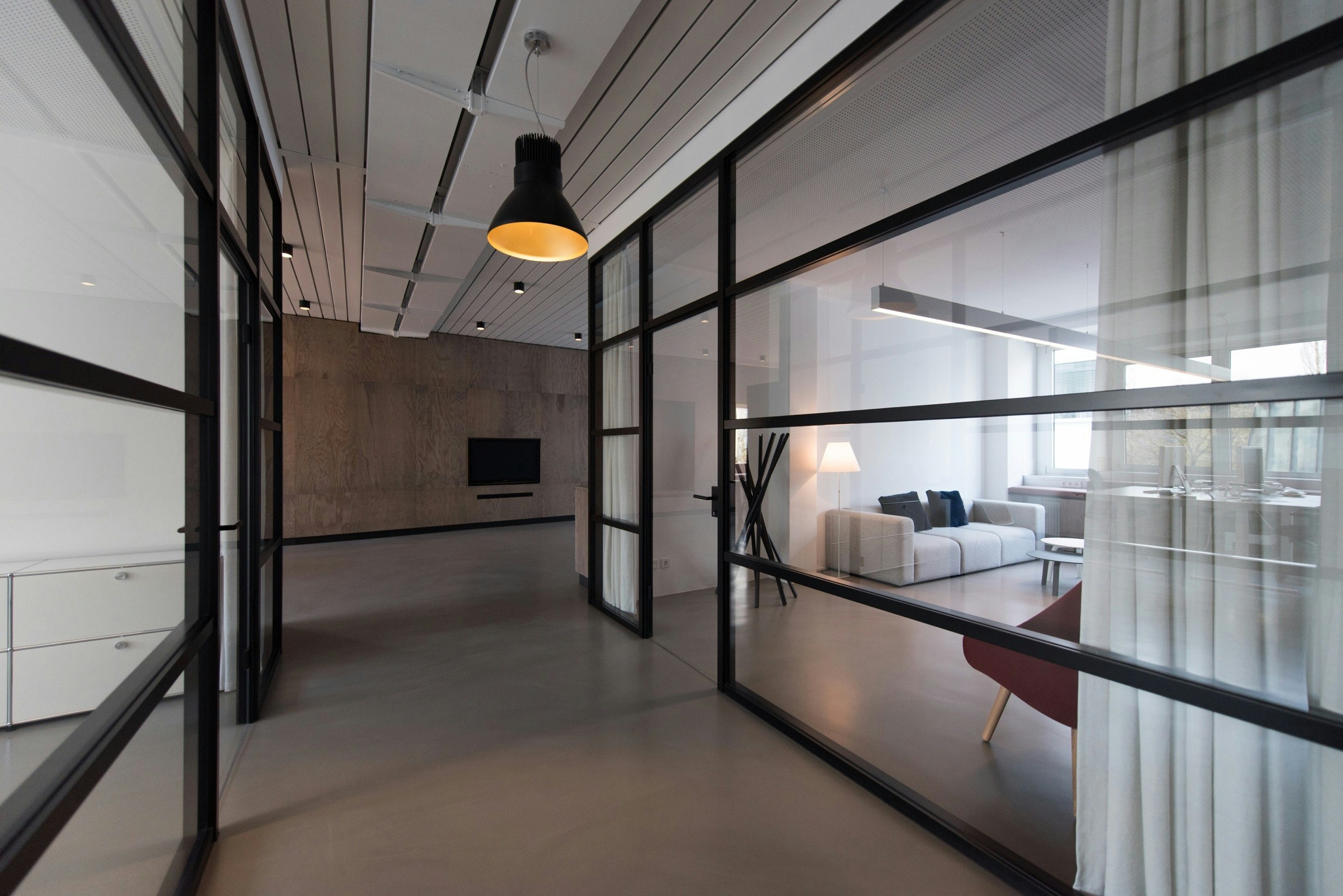 A light-filled contemporary workspace with glass meeting rooms